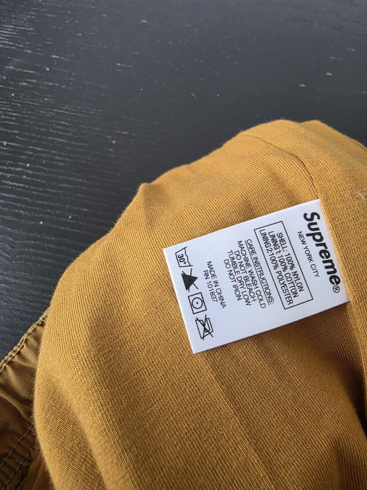 SS21 Supreme Spellout Track Pant Dark Gold Size M