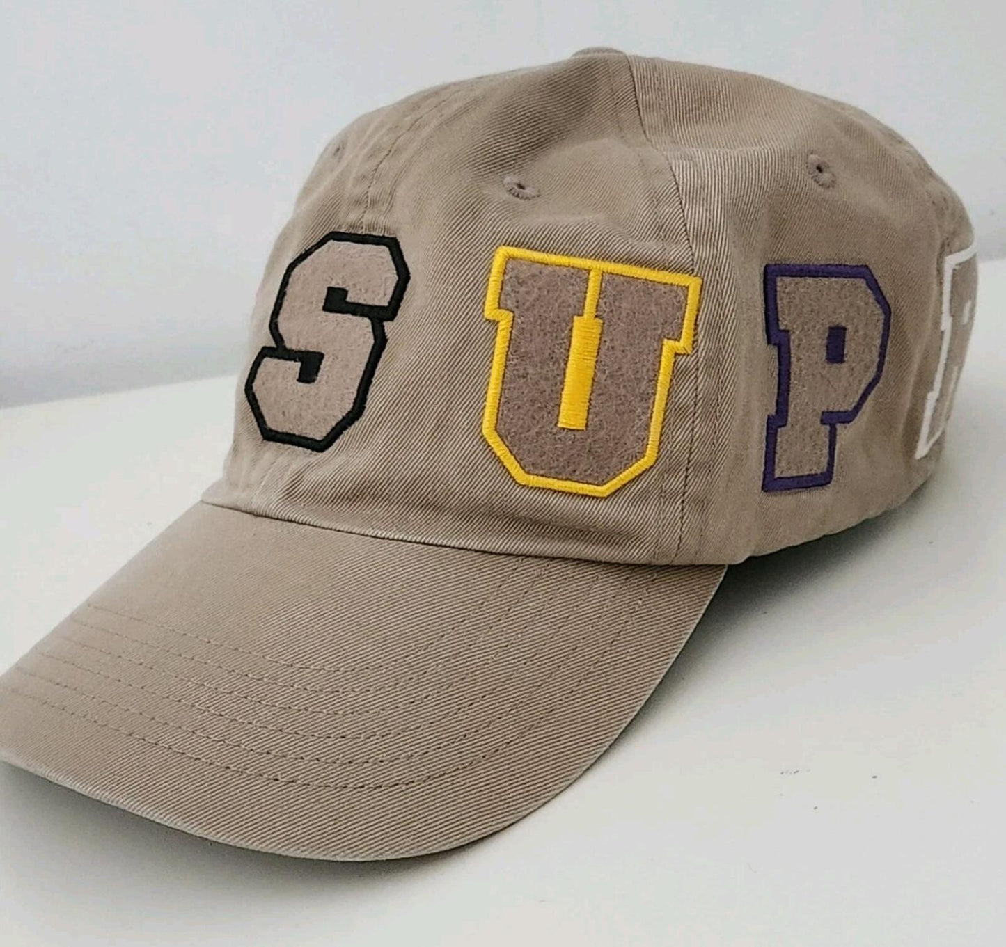 SS21 Supreme Spellout 6-panel Tan twill hat felt logo cap
