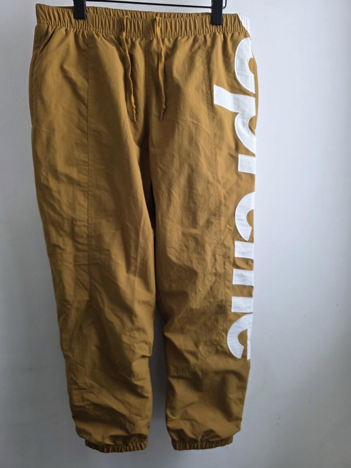 SS21 Supreme Spellout Track Pant Dark Gold Size M