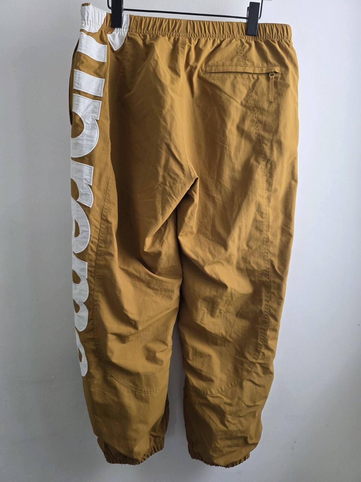 SS21 Supreme Spellout Track Pant Dark Gold Size M