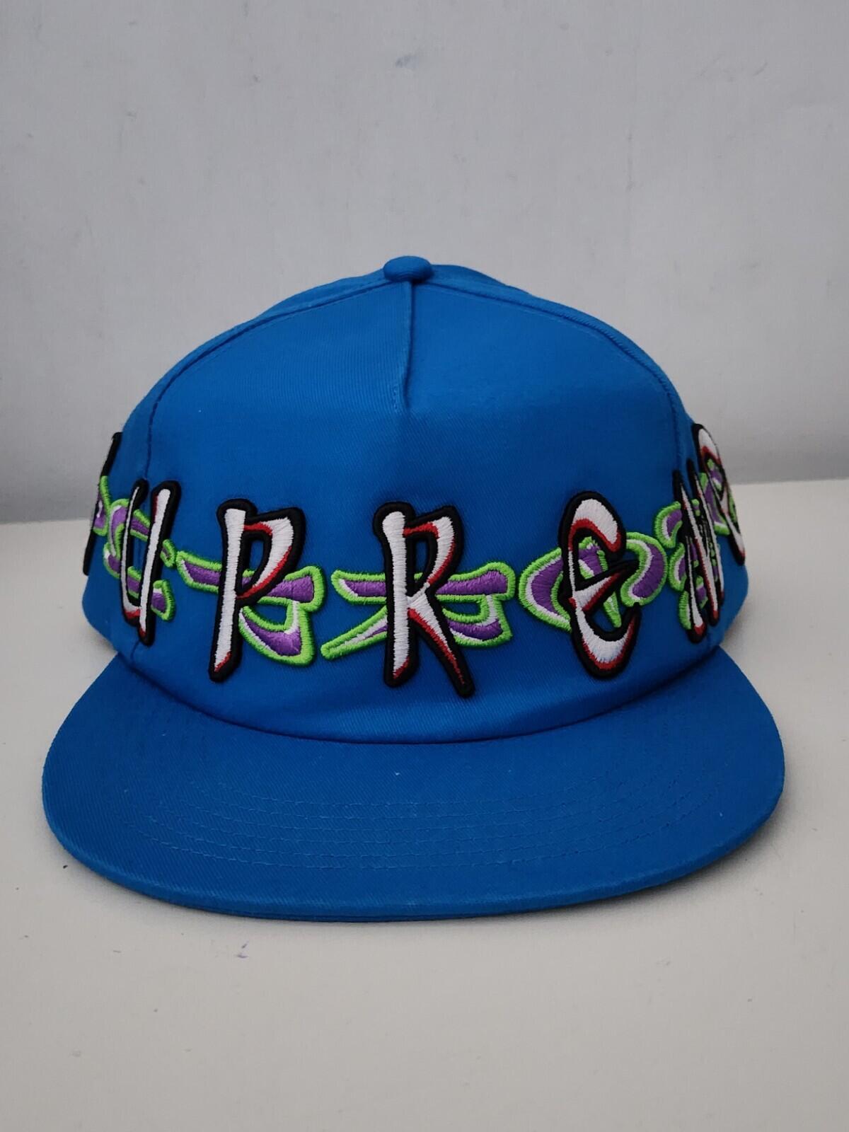 FW23 Supreme AOI Spellout 5-panel blue hat cap embroidered artwork by AOI