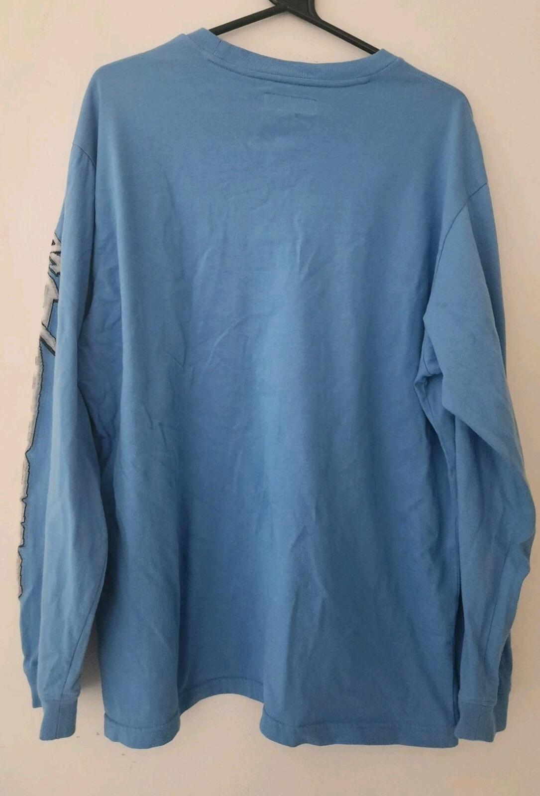 Camiseta de manga larga FW23 Supreme Racing Intarsia azul talla M cuello redondo