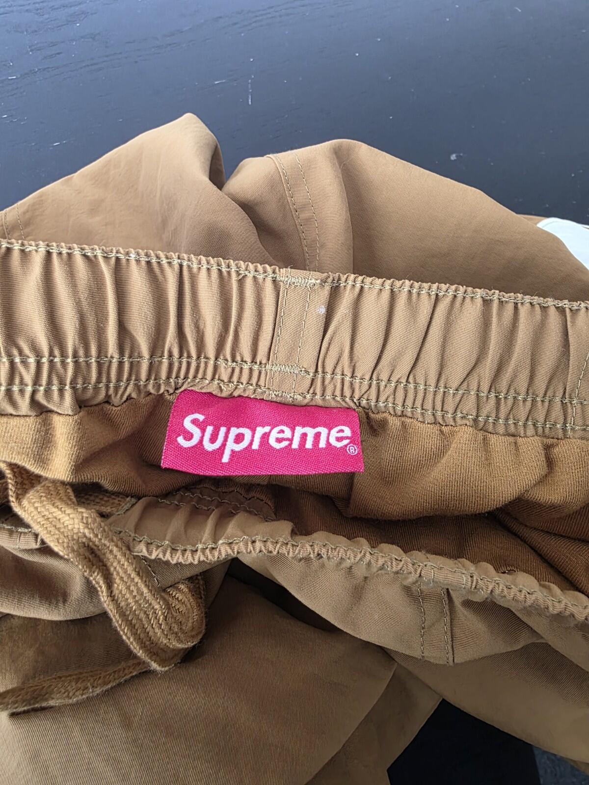 SS21 Supreme Spellout Track Pant Dark Gold Size M