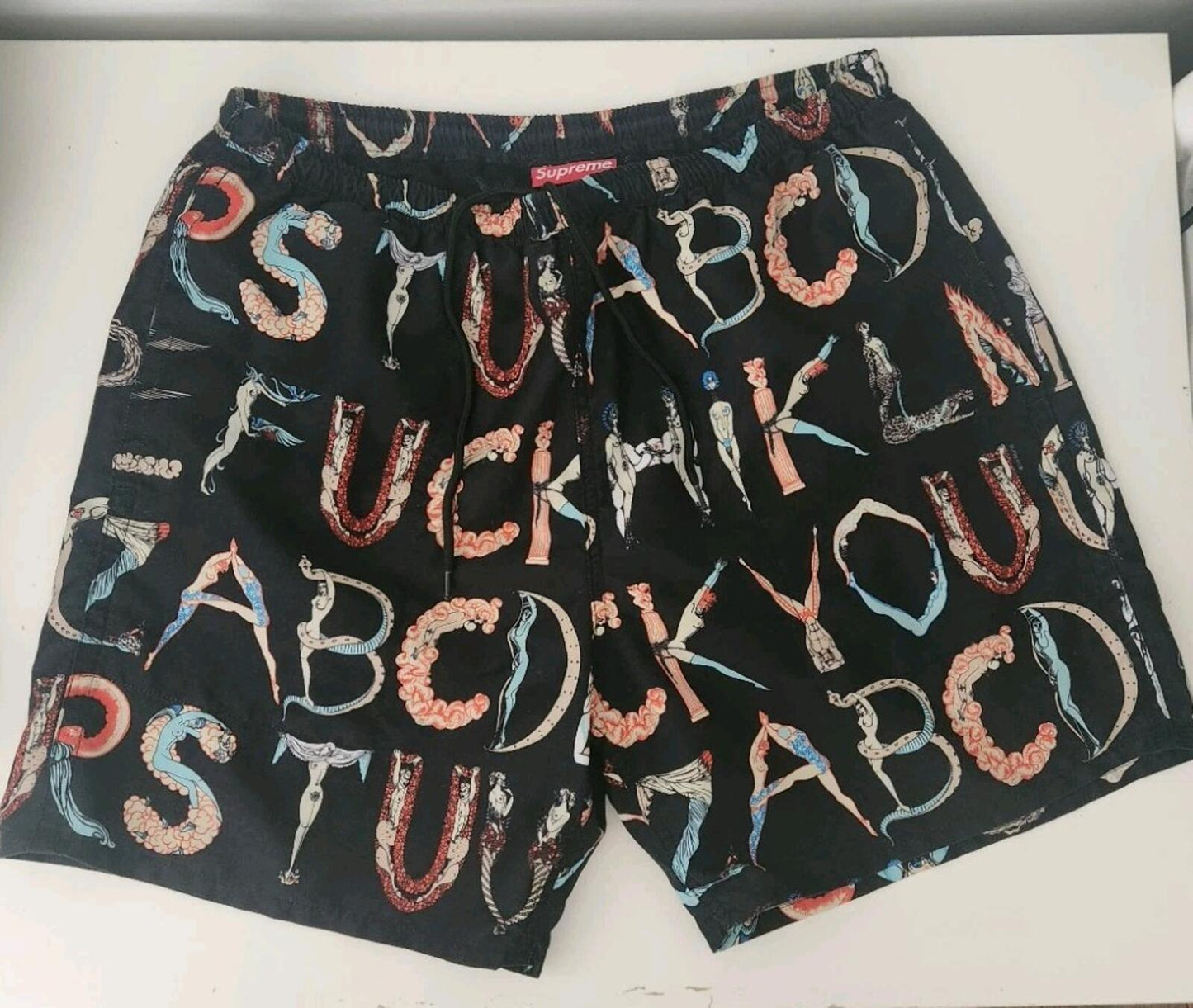 SS18 Supreme Alphabet Water Short Black M Original artwork by Erte. ©Sevenarts