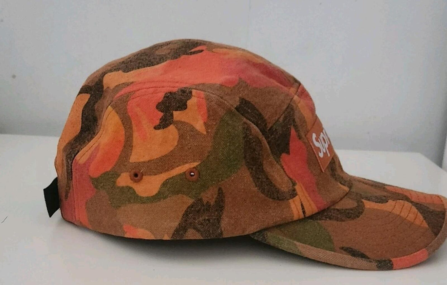Gorra de campamento de lona lavada Supreme SS24 color naranja camuflaje