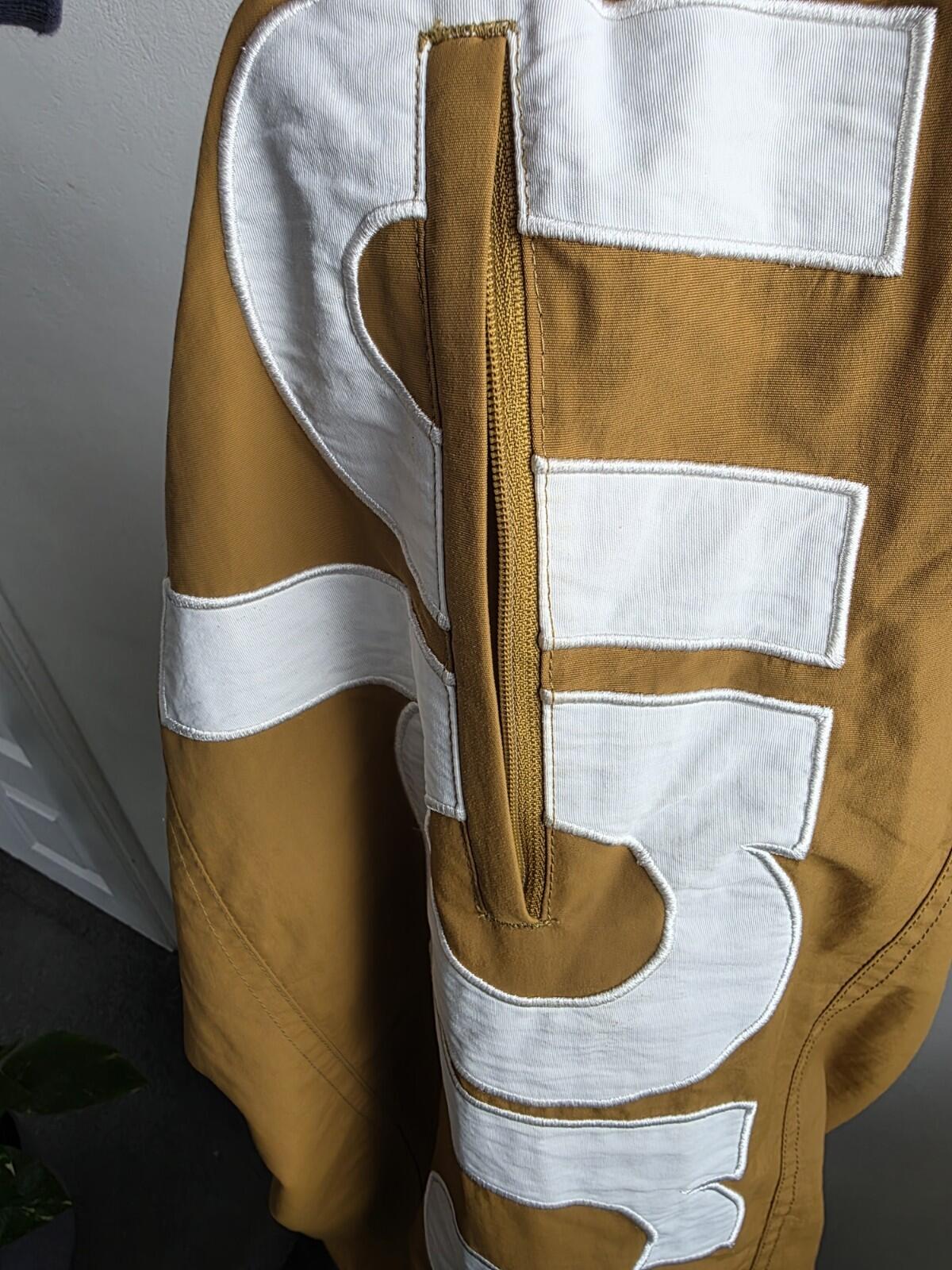 SS21 Supreme Spellout Track Pant Dark Gold Size M